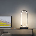 Luminova kompaktní oválná lampa s železným povrchem pro moderní pokoje