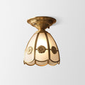 Lampada da parete in metallo con una lampadina, finitura ottone, design smerlato, semi-incassata