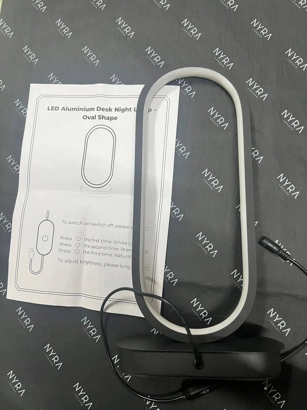 Luminova kompaktní oválná lampa s železným povrchem pro moderní pokoje