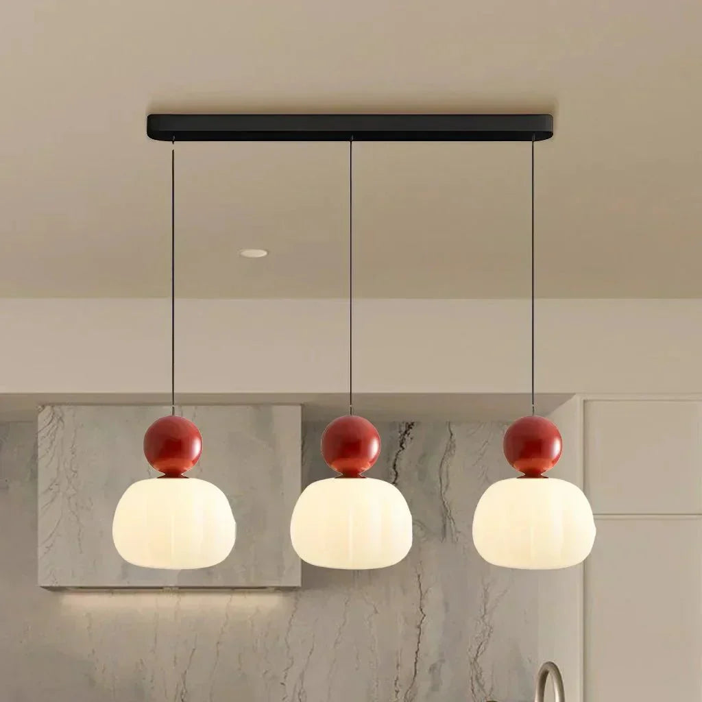 Kugelförmige Pendelleuchte mit Diffusor und metallischen Akzenten, 12 Zoll | Rosalyssa