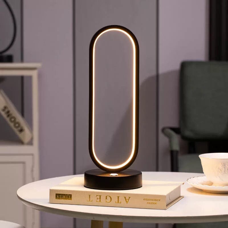 Luminova kompaktní oválná lampa s železným povrchem pro moderní pokoje