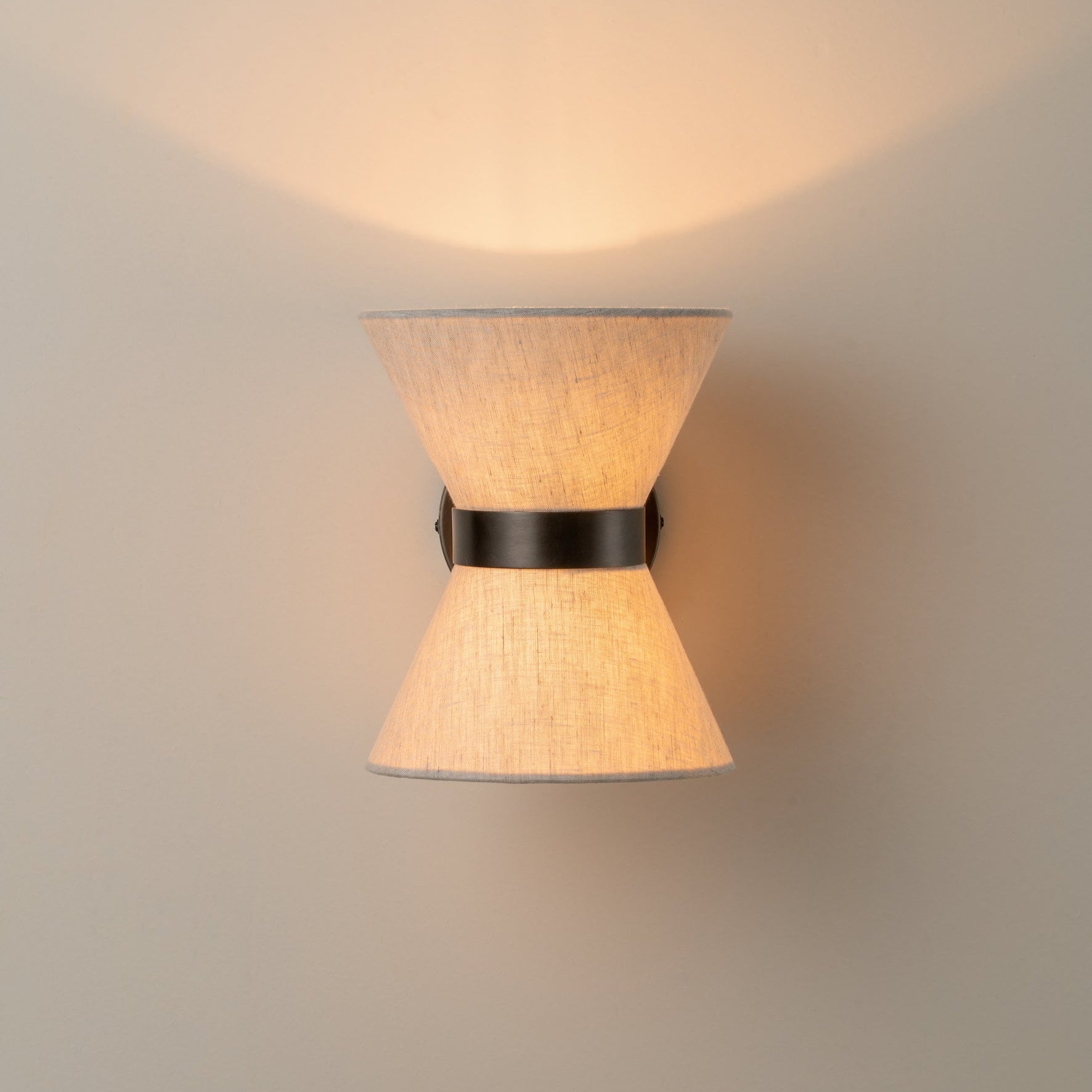 Bronze & Linen Wall Light Delivers Warm, Tranquil Illumination