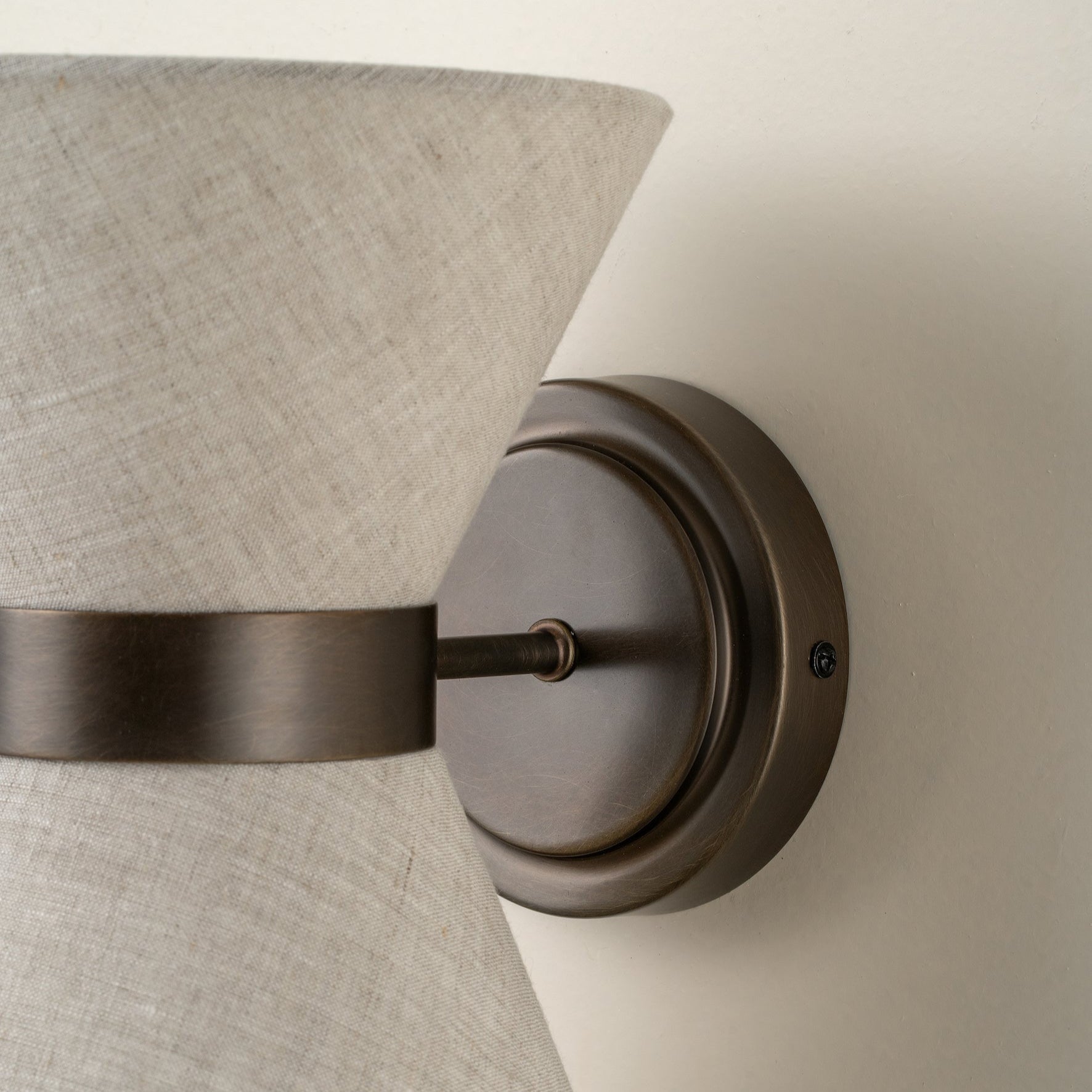Bronze & Linen Wall Light Delivers Warm, Tranquil Illumination