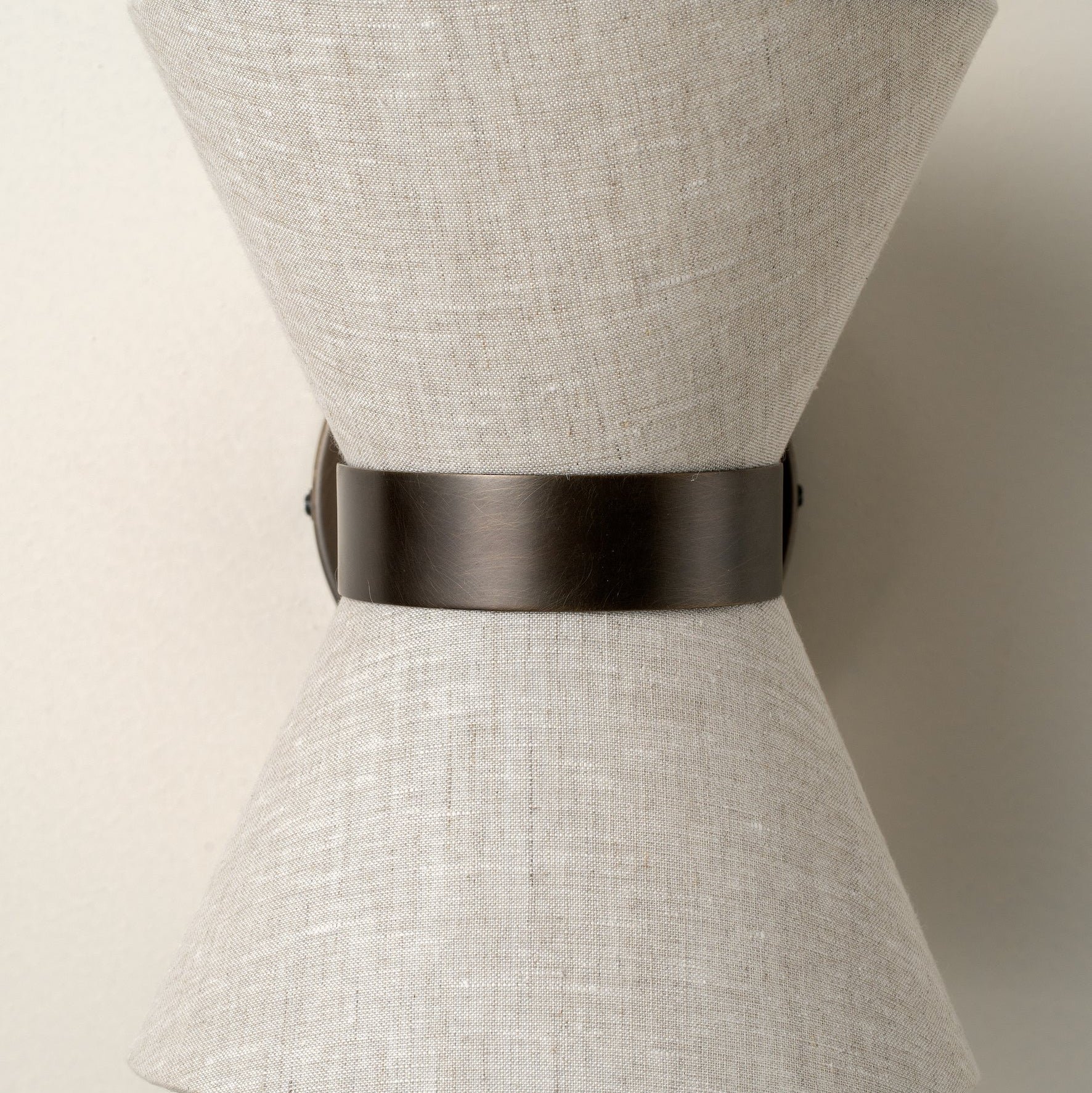 Bronze & Linen Wall Light Delivers Warm, Tranquil Illumination